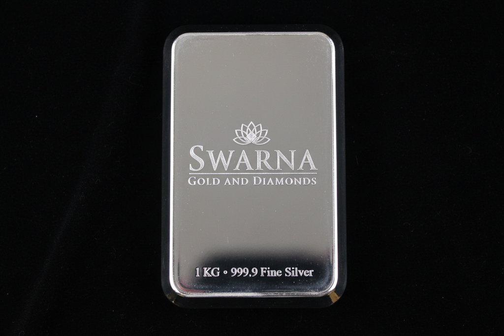 Front view of Swarna 1kg Fine Silver Bar with Swarna lotus logo engraved